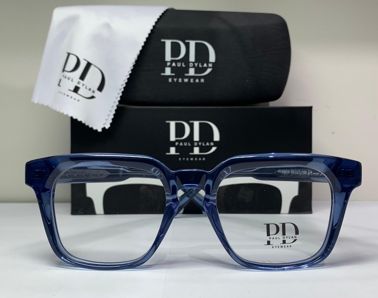 Paul Dylan · Blue Acetate — Bold square profile in translucent blue acetate for a confident, contemporary look.